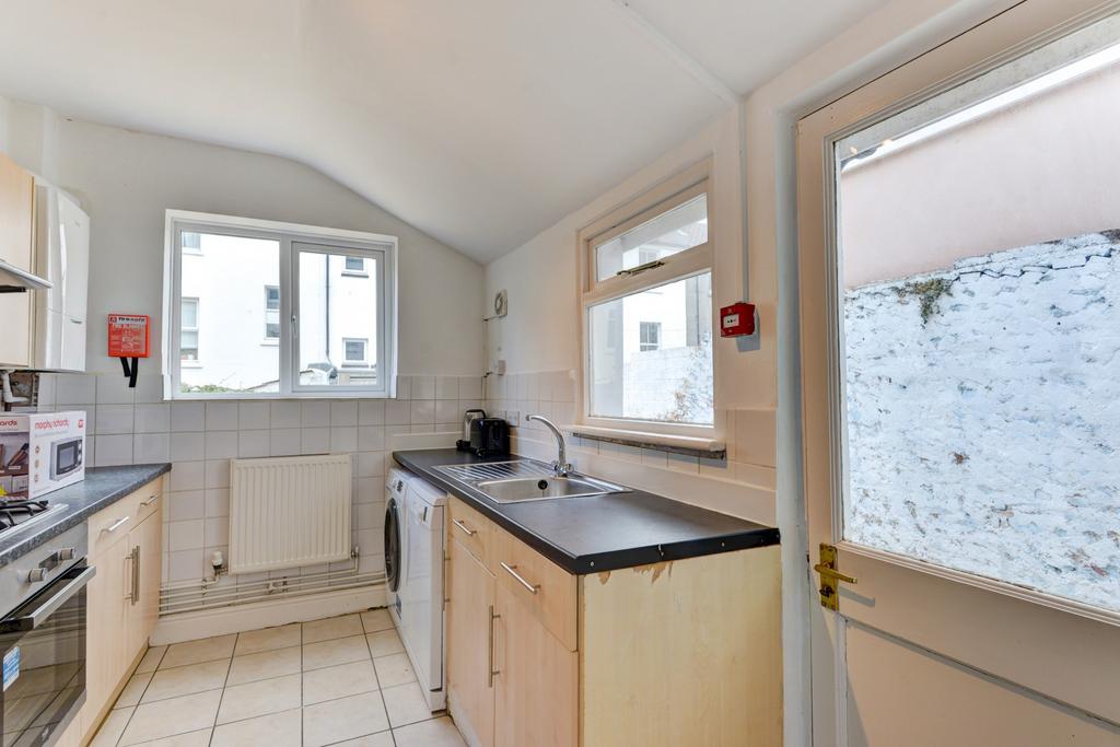 Bright and clean kitchen with ample natural lig...