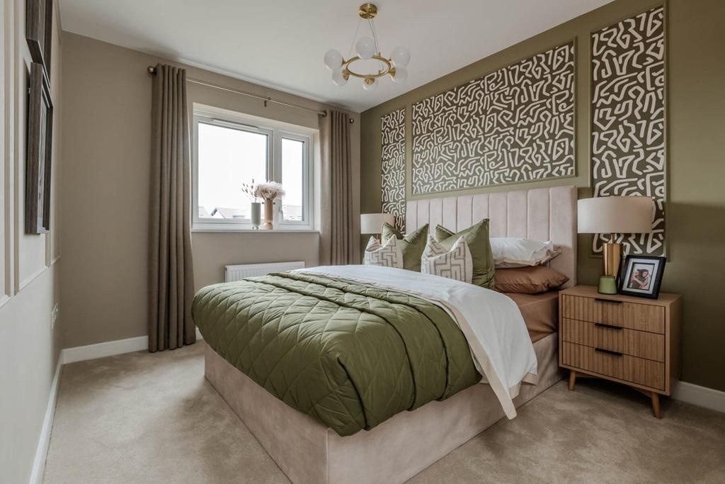 The main bedroom features an en suite for added...