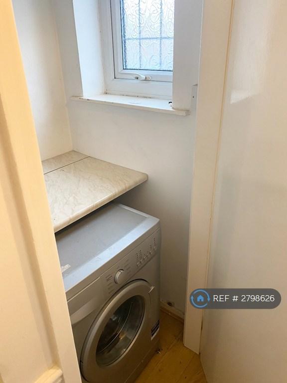 Downstairs Storage And Washing Machine