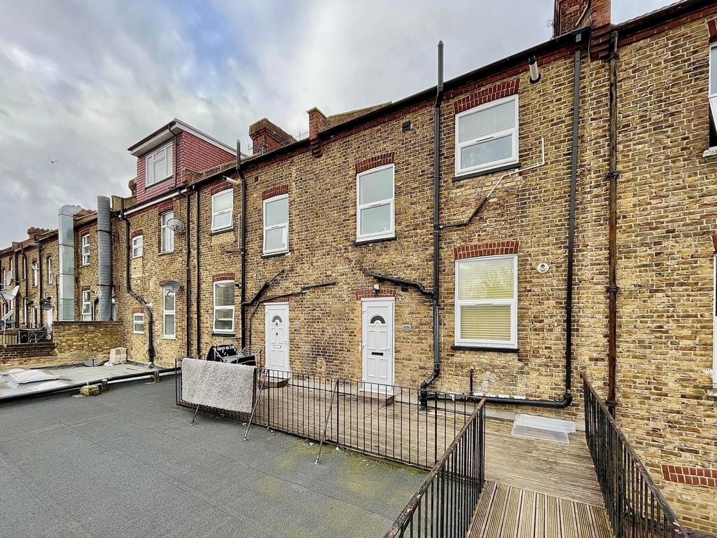 Brick terraced property with traditional sash-s...
