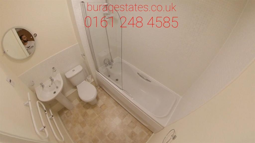 Bright, well-maintained bathroom featuring a ba...