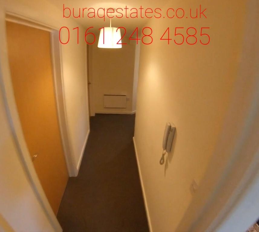 Narrow internal hallway with a fitted carpet, n...