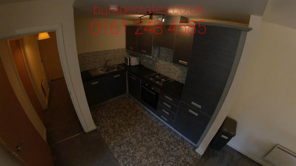 Compact modern kitchen with integrated applianc...