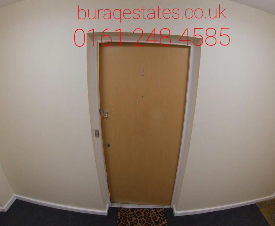 Well-maintained internal hallway with a secure ...
