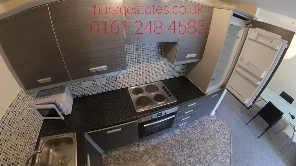 Bright modern kitchen with integrated appliance...