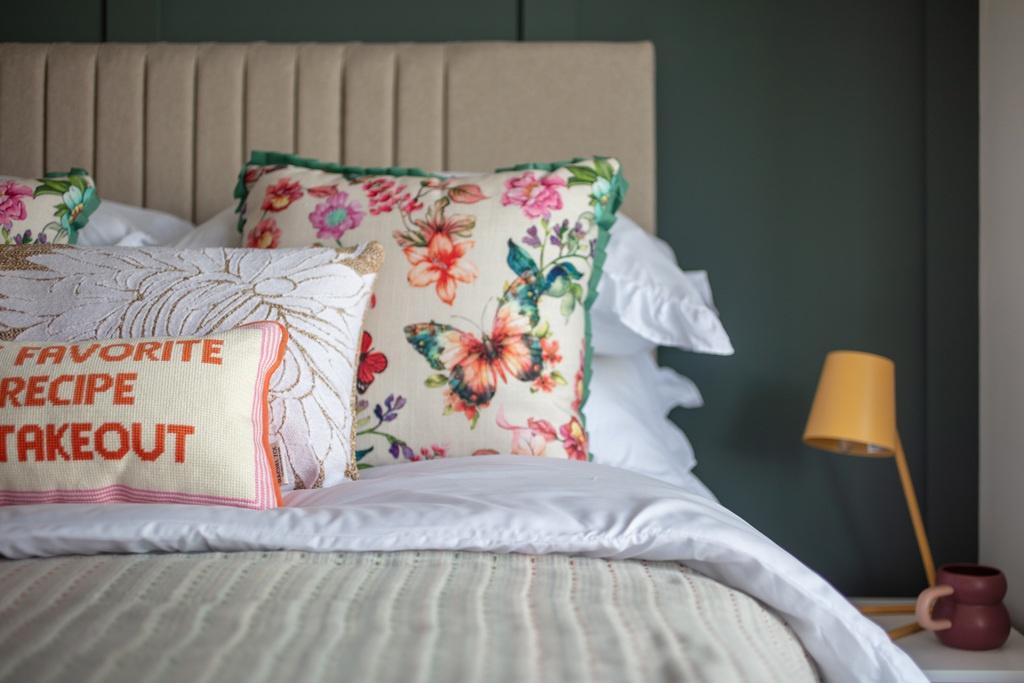 Bright, well-styled bedroom with a comfortable ...