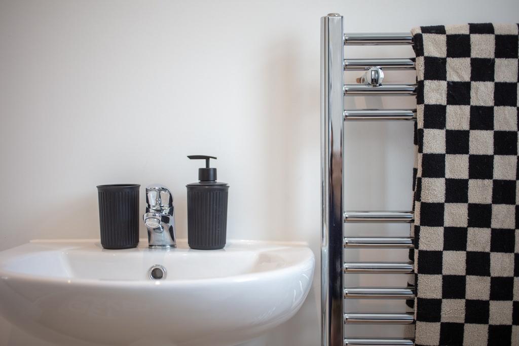 Modern bathroom basin with chrome mixer tap, ma...