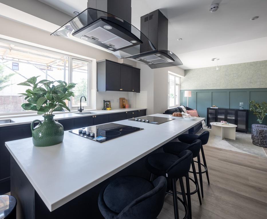 Modern open-plan kitchen with a large central i...