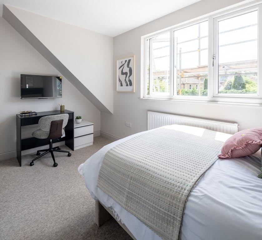 Bright, freshly decorated bedroom with a comfor...