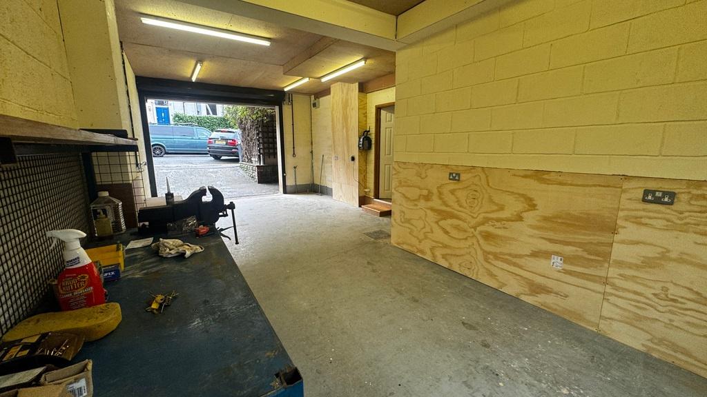Long, secure storage/garage space with concrete...