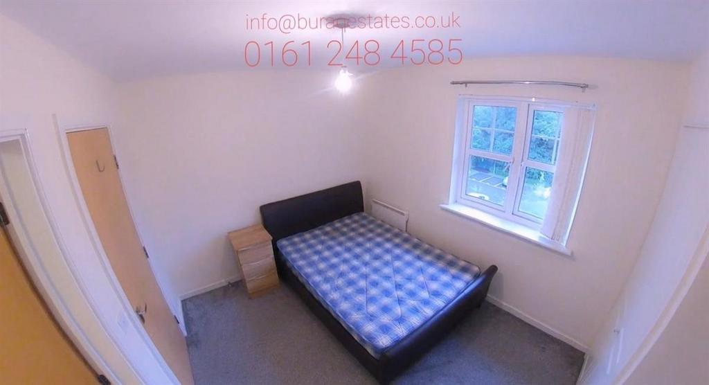 Bright, simply furnished double bedroom with a ...