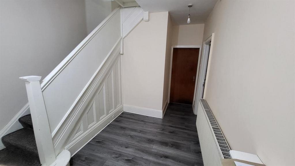 Clean, modern hallway with fitted radiator, neu...