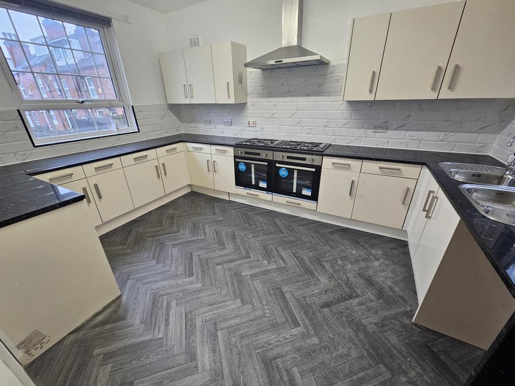 Bright modern kitchen with abundant worktop spa...