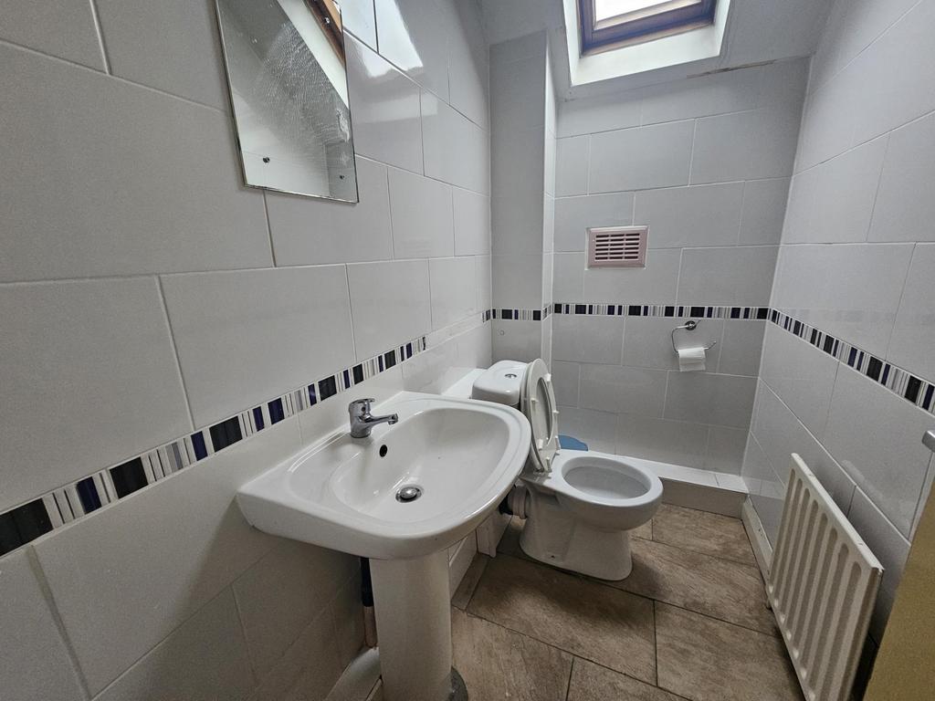 Bright, recently refurbished bathroom featuring...