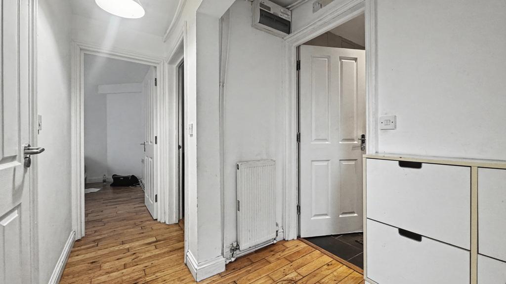 Bright, well-maintained hallway with wood-effec...