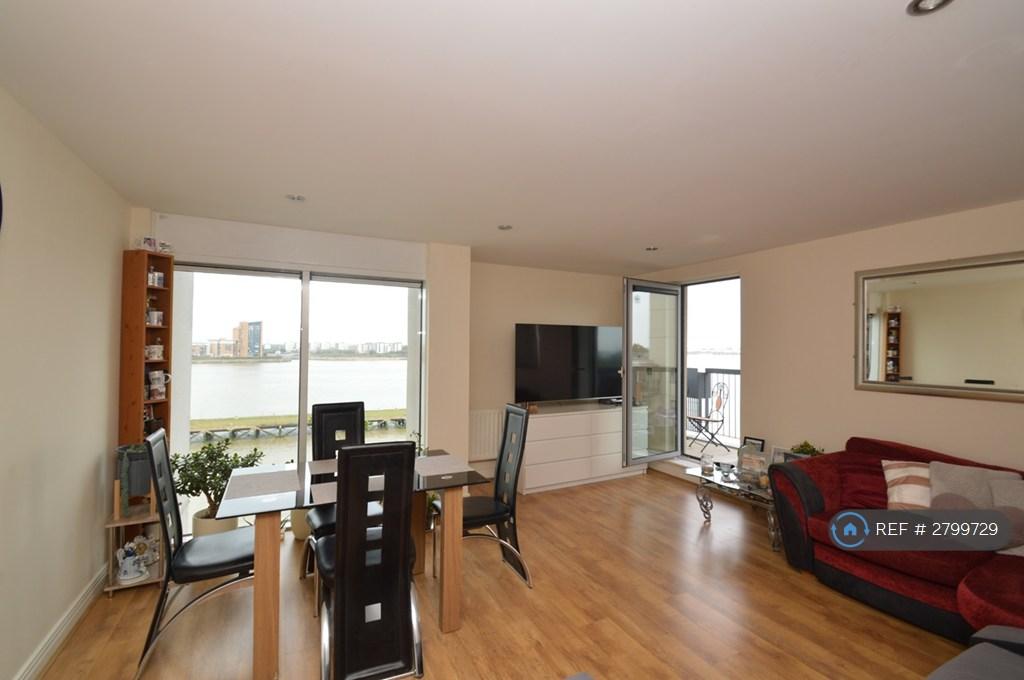Spacious Living Room With Balcony And River Views