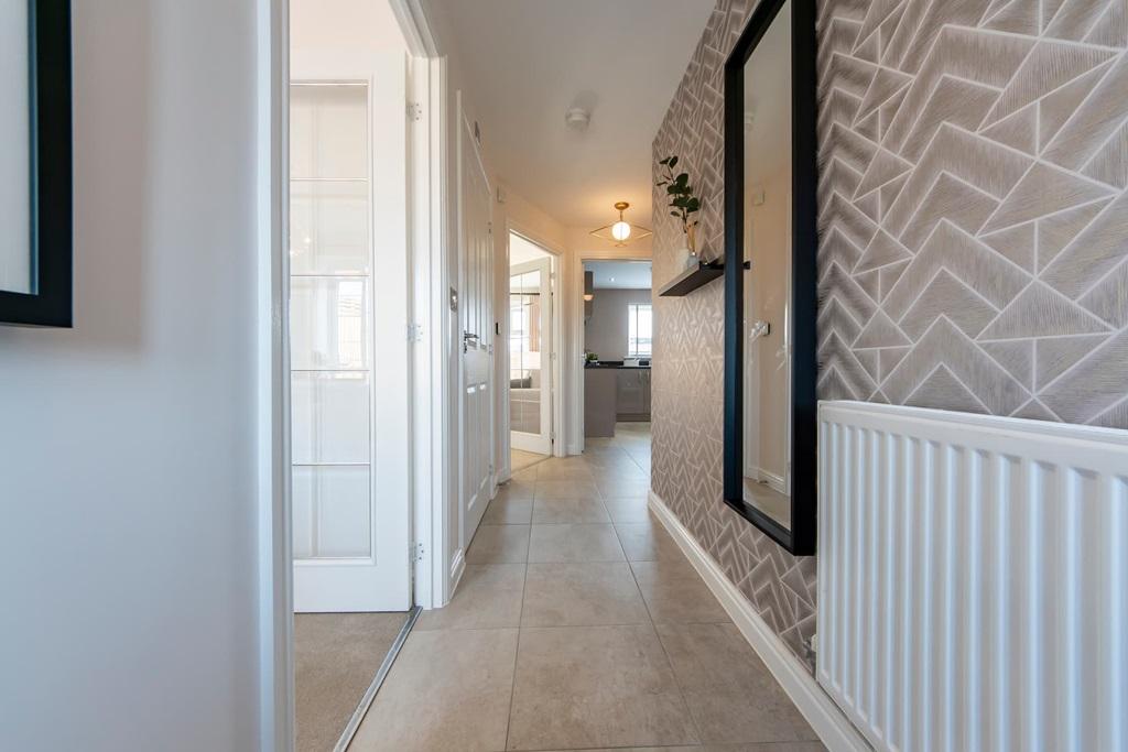 A long bright hallway welcomes you to your new...