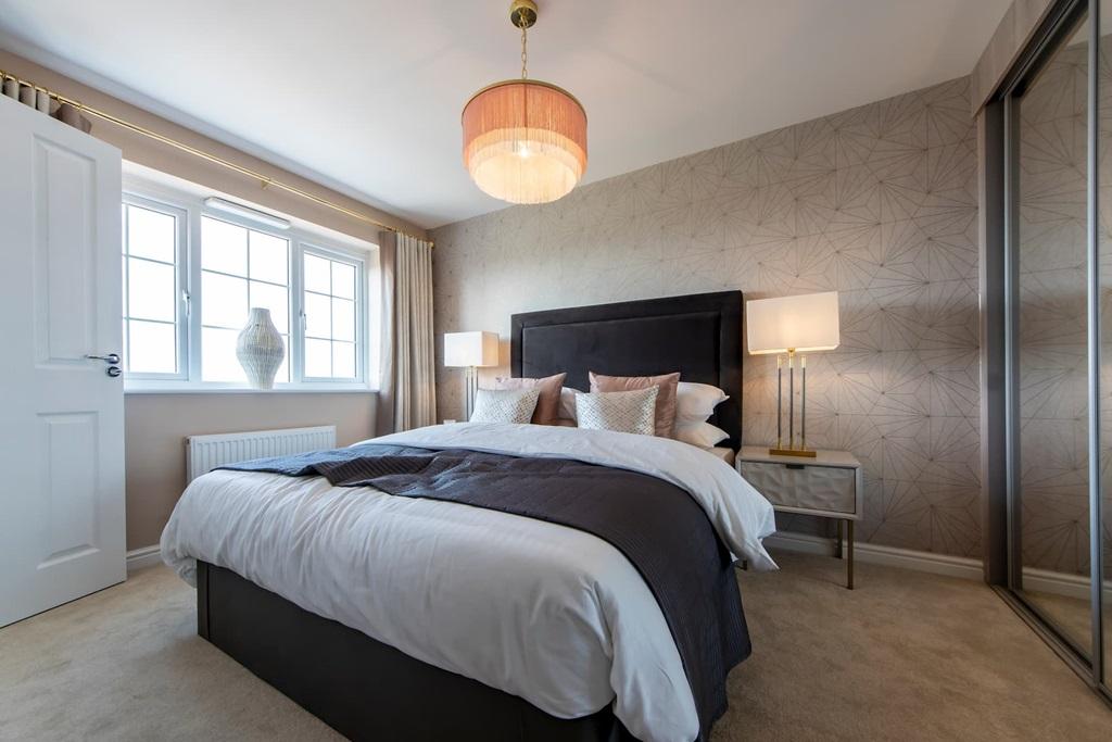 A modern en-suite shower room completes the...