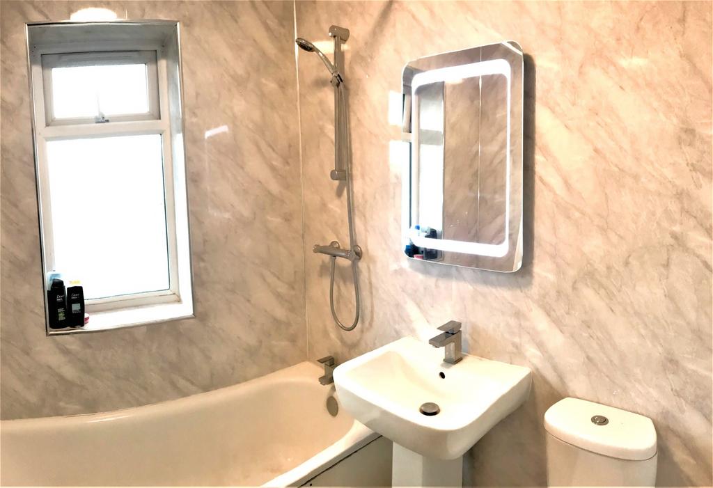 A modern bathroom featuring a sleek design with...