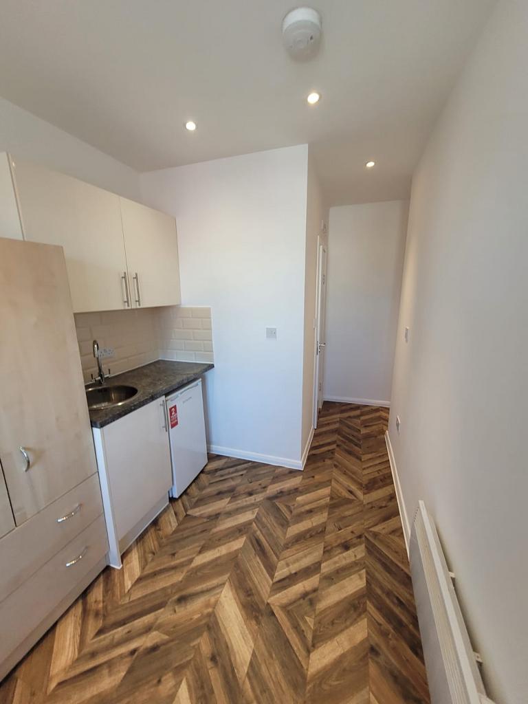 Bright, modern kitchenette with stylish herring...