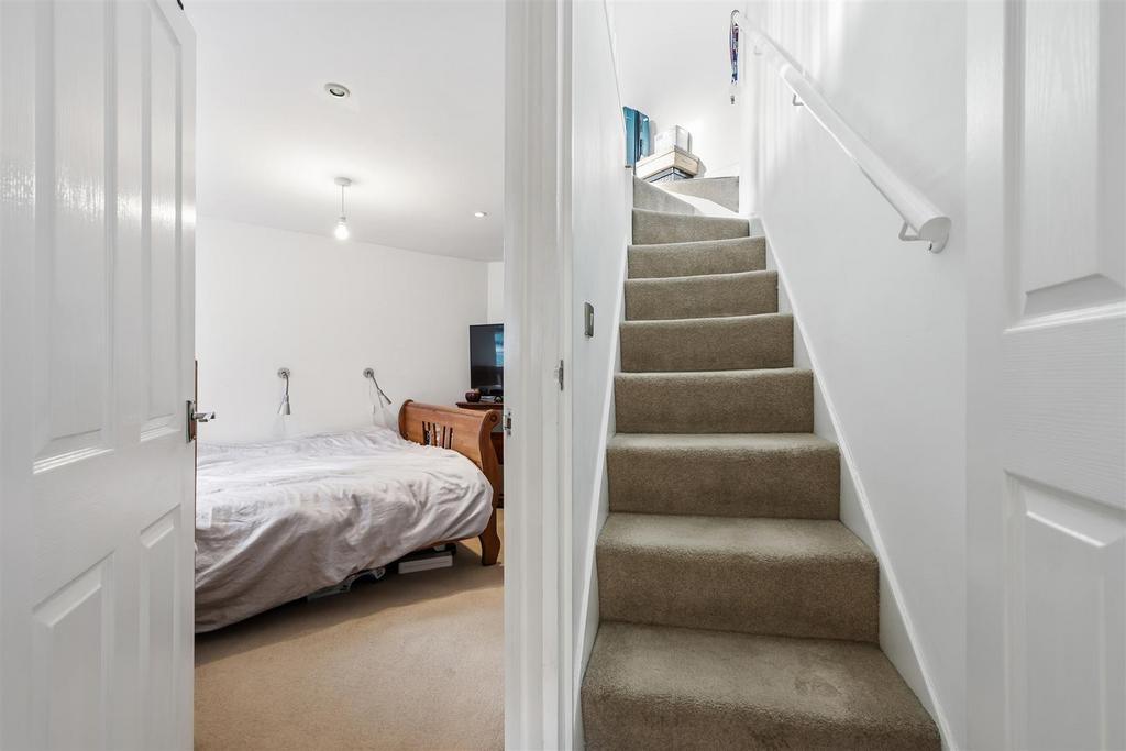 Bedroom Two and stairs to Master Bedroom.jpg