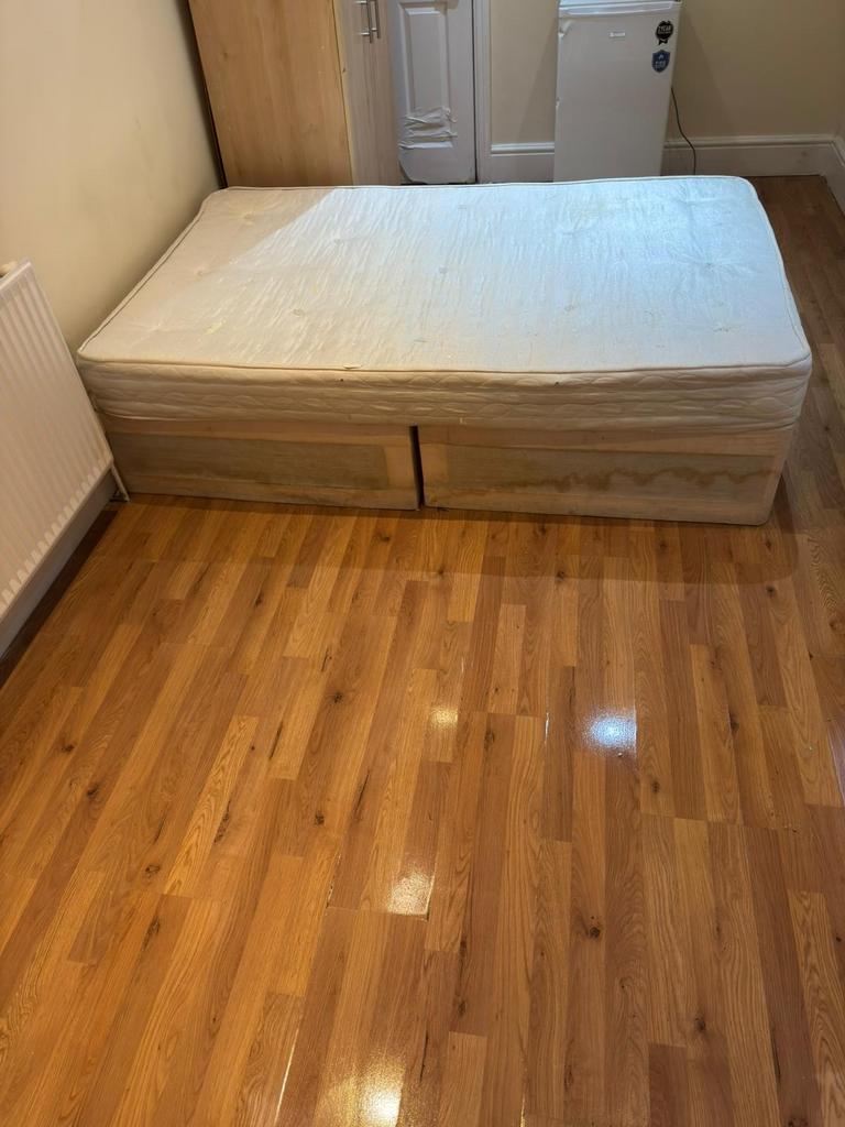 Neat single bedroom with a divan-style bed, pol...
