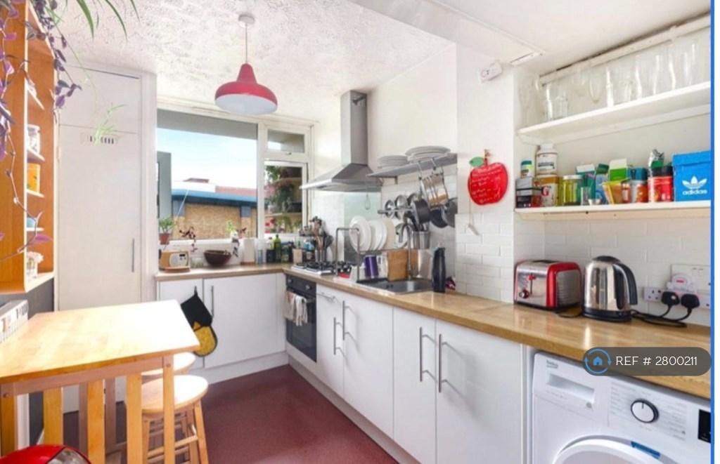 Kitchen With Table And Stools