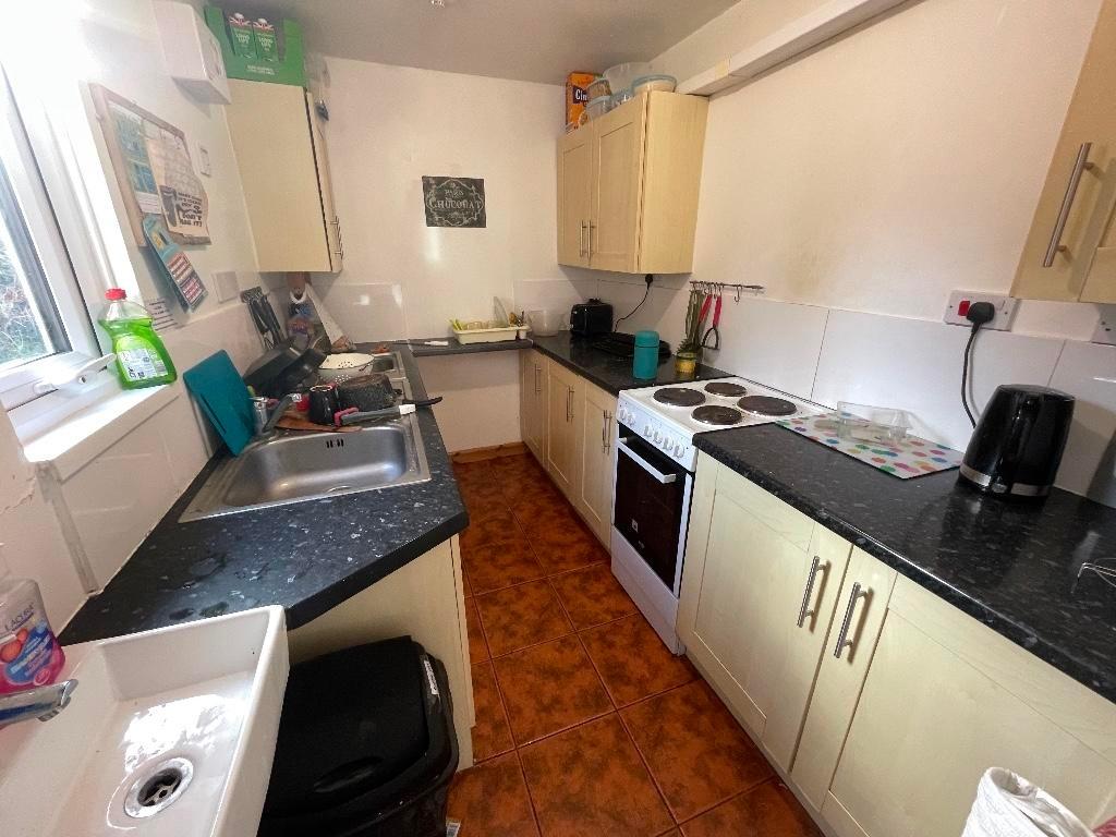 Bright galley kitchen with plenty of worktop sp...