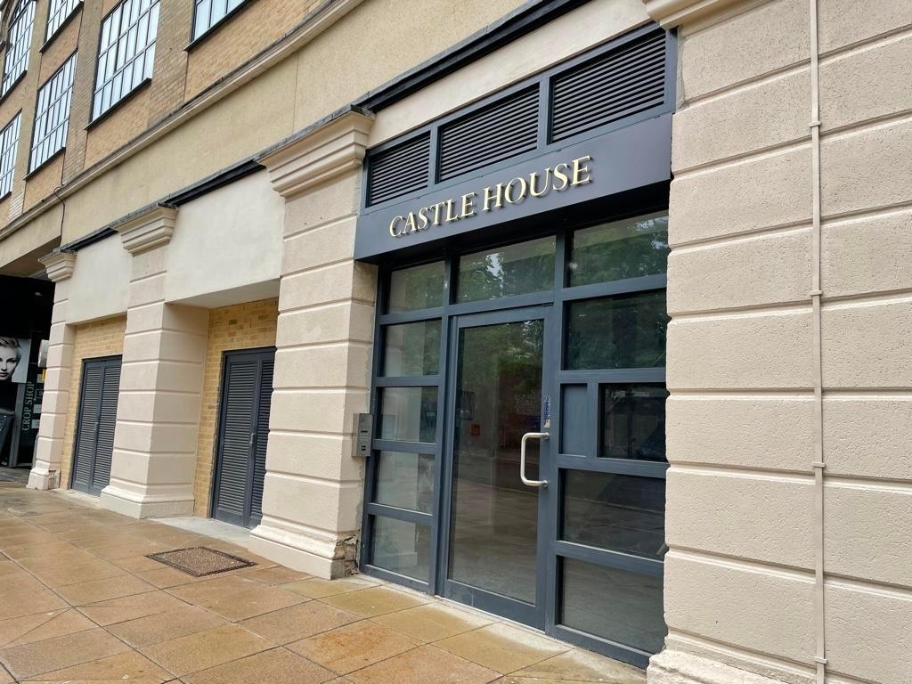 Attractive building entrance with modern glass ...