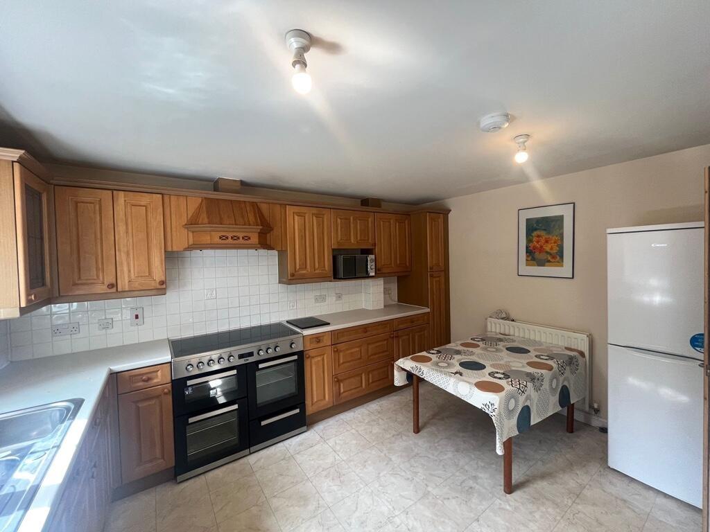 Bright, well-equipped kitchen with timber cabin...