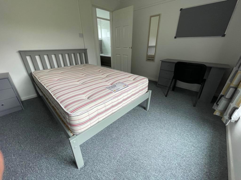 Bright, neatly presented bedroom with a double ...