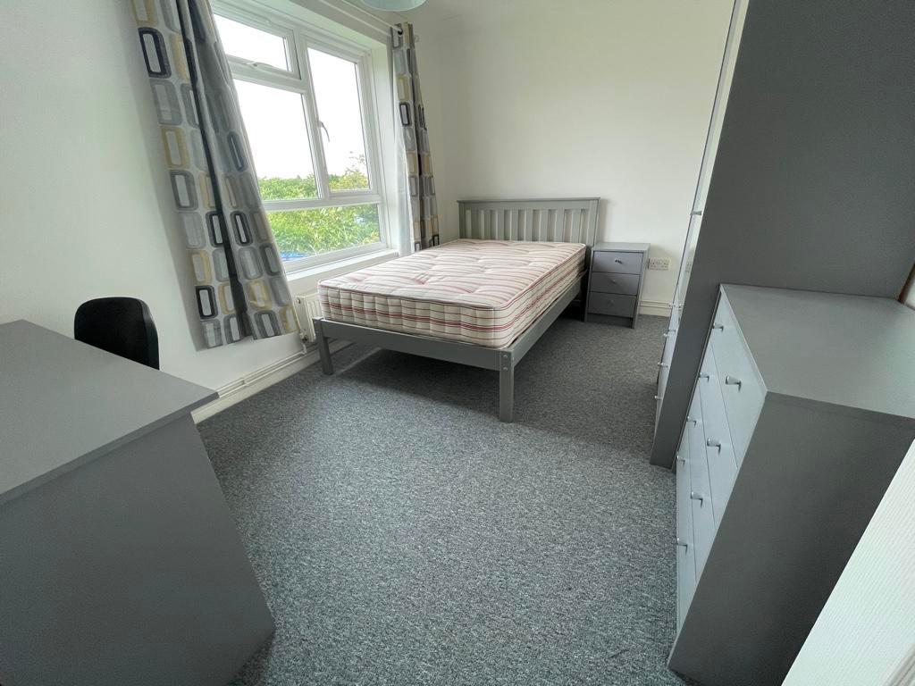 Bright, neatly presented bedroom with a double ...
