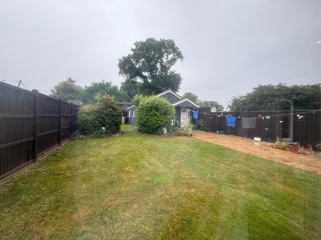 Private, well-kept rear garden with a level law...