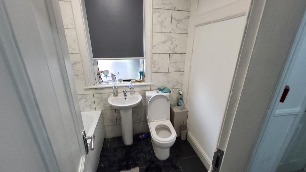 Bright, recently refreshed bathroom with a pede...