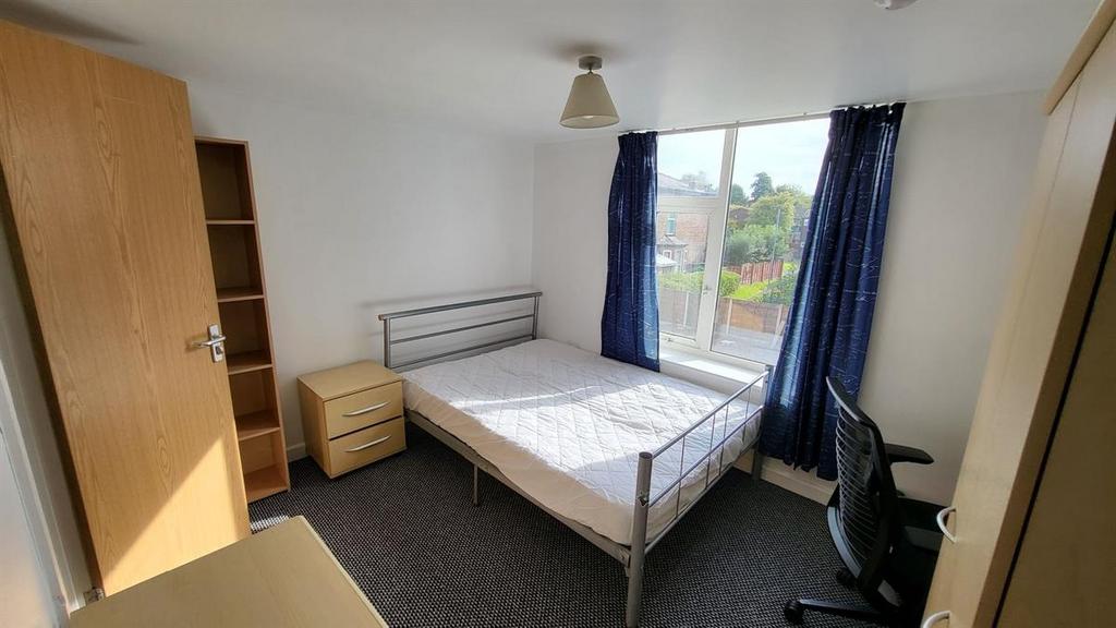Bright, neatly presented bedroom with a double ...