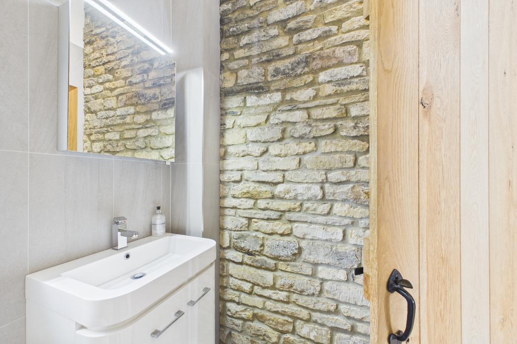 Beautiful exposed brick wall in bedroom 2 ensuite