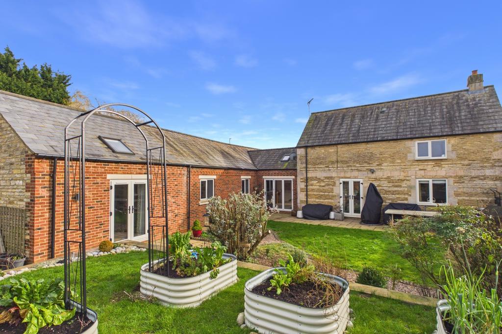 Raised beds, established shrubs and a useful stora