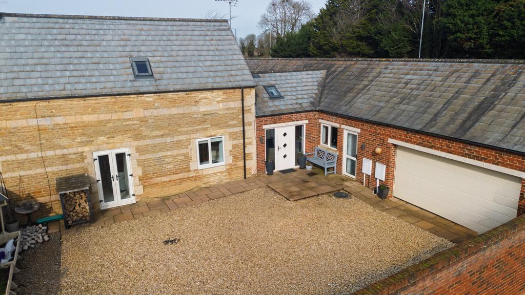 A driveway providing parking but also a courtyard