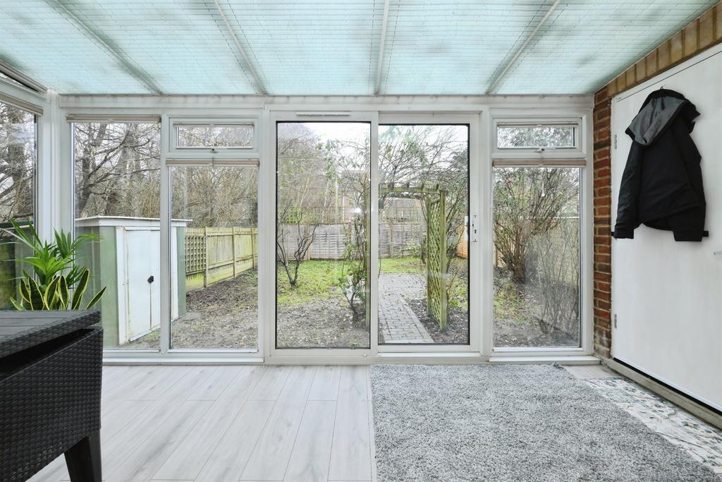 Conservatory interior, conservatory, french doors leading to garden