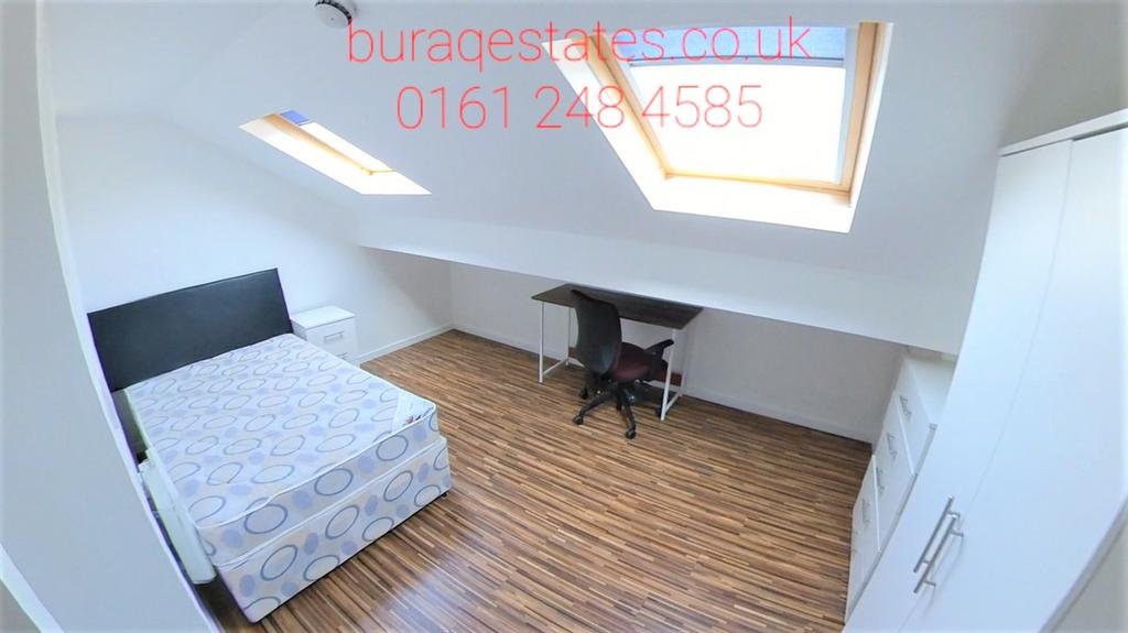 Bright, neatly presented bedroom with two skyli...