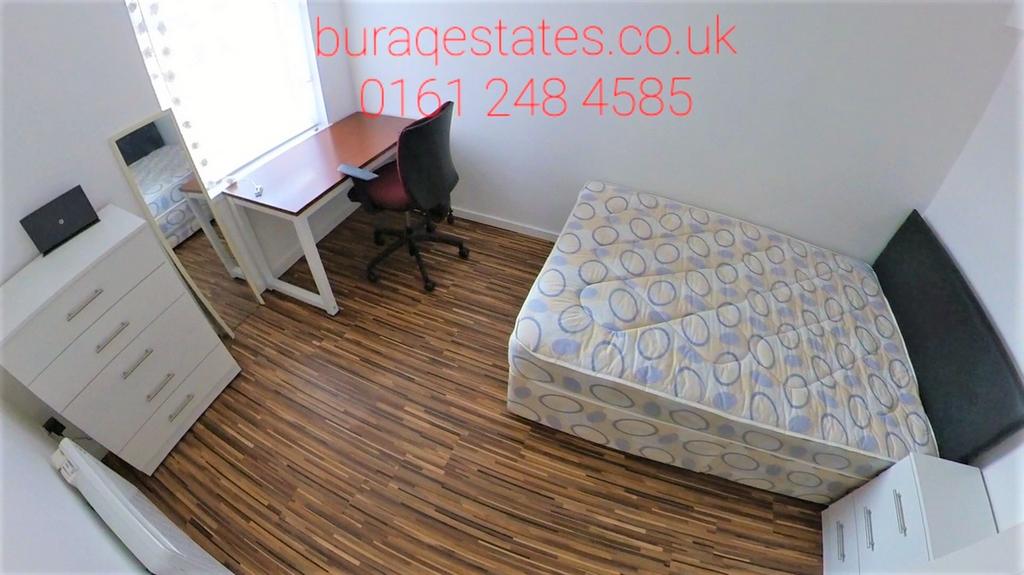 Bright, simply furnished bedroom with a single ...