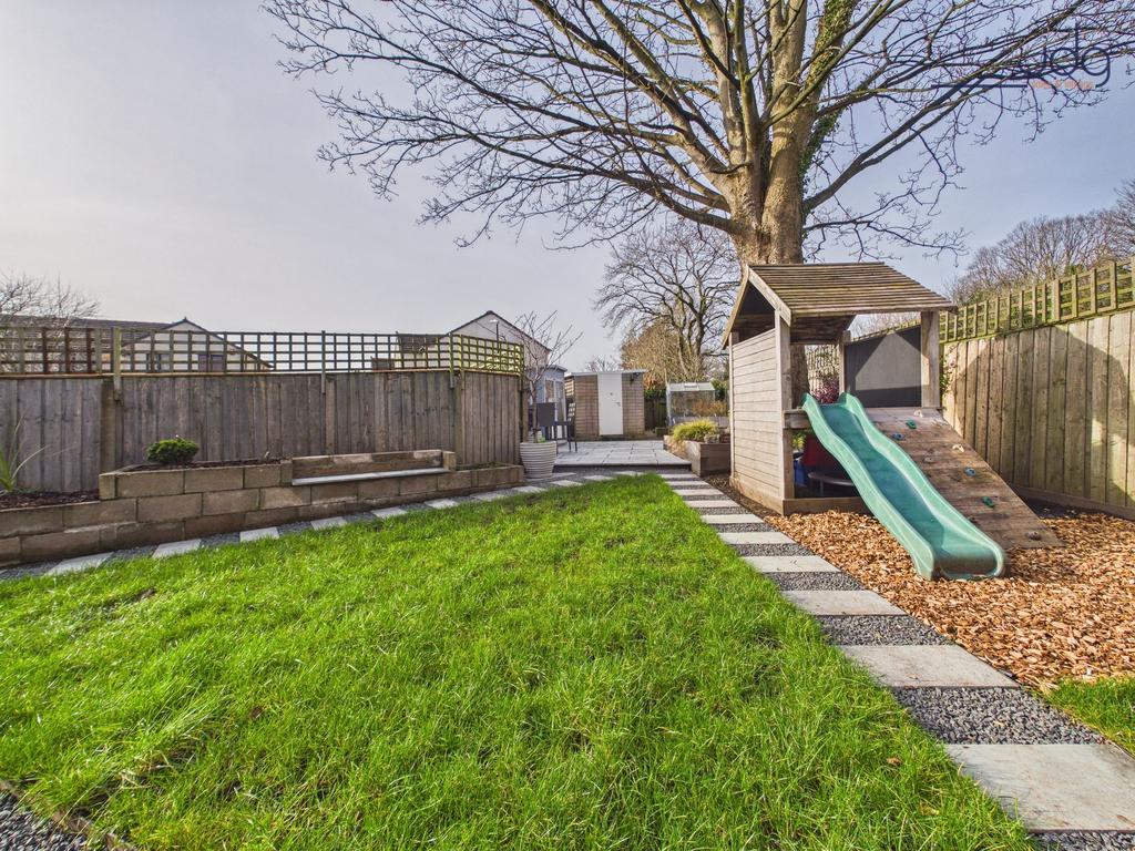 Large Garden with a mixture of lawn and flagged...
