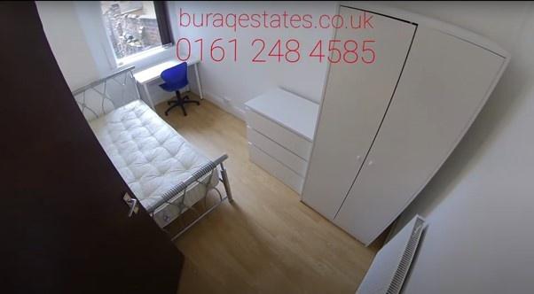 Bright, simply furnished single bedroom with a ...