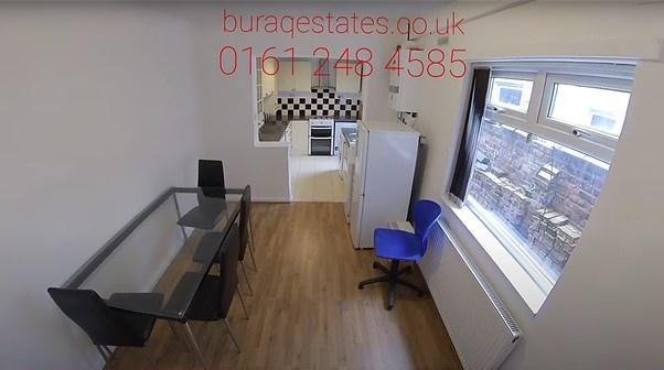 Well-presented open-plan living area with woode...