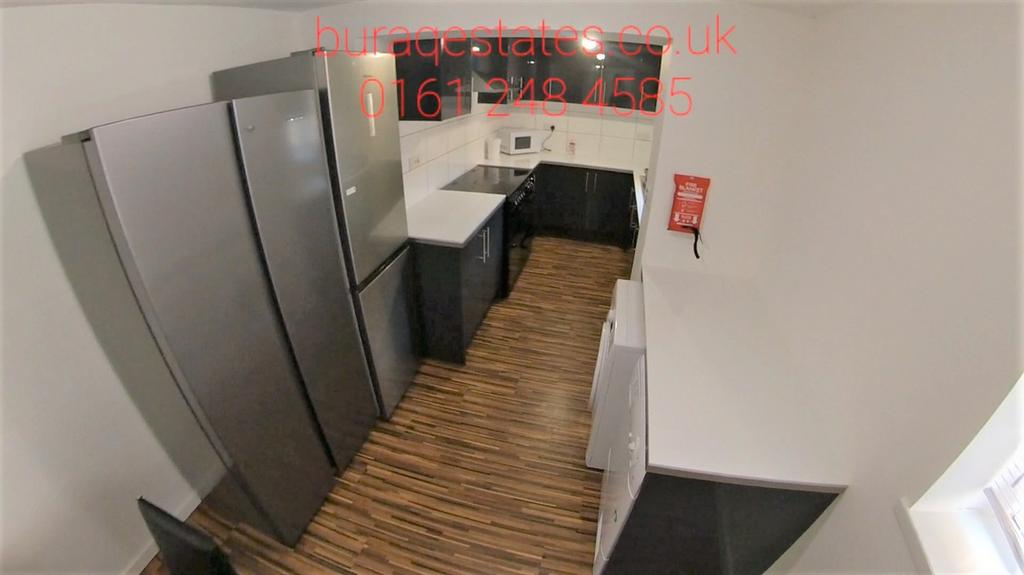 Modern galley kitchen with fitted appliances, s...