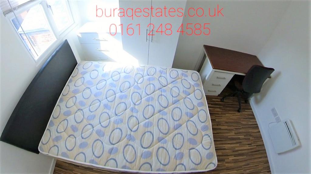 Bright single bedroom with a large window, simp...