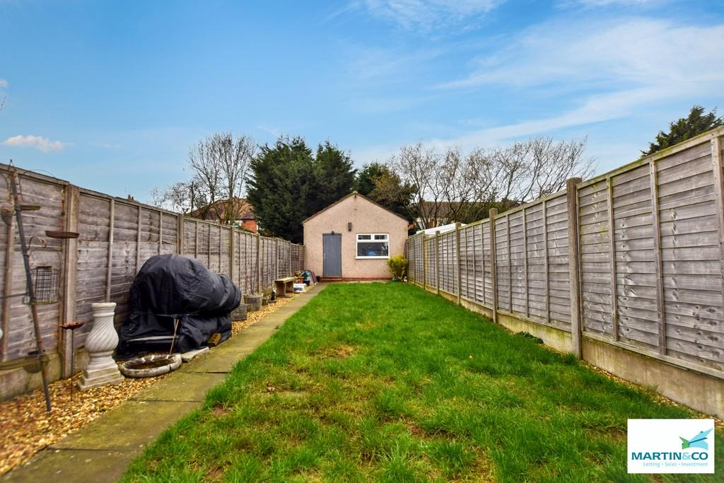 Rear garden with detached garage