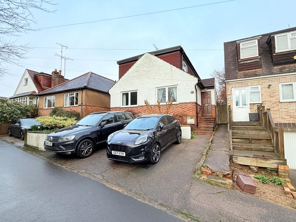 Street scene with property, parking