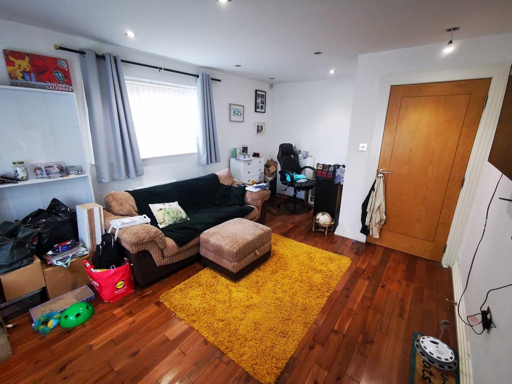 Bright, well-lit living room with a comfortable...