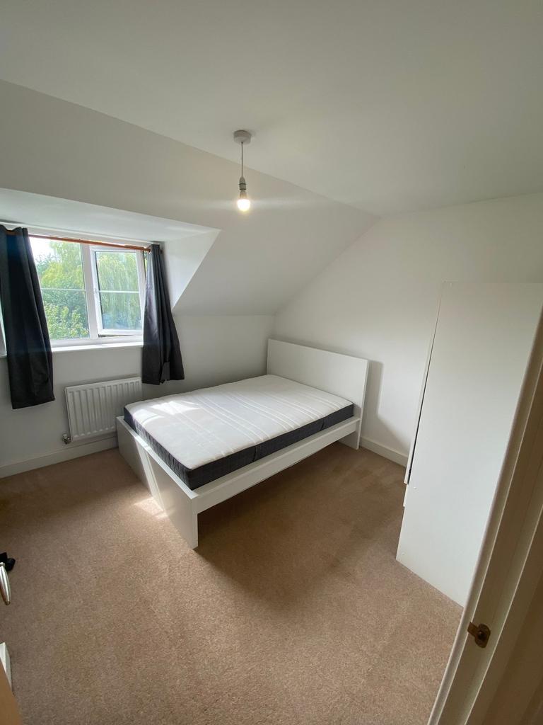 Bright, neatly presented bedroom with a double ...